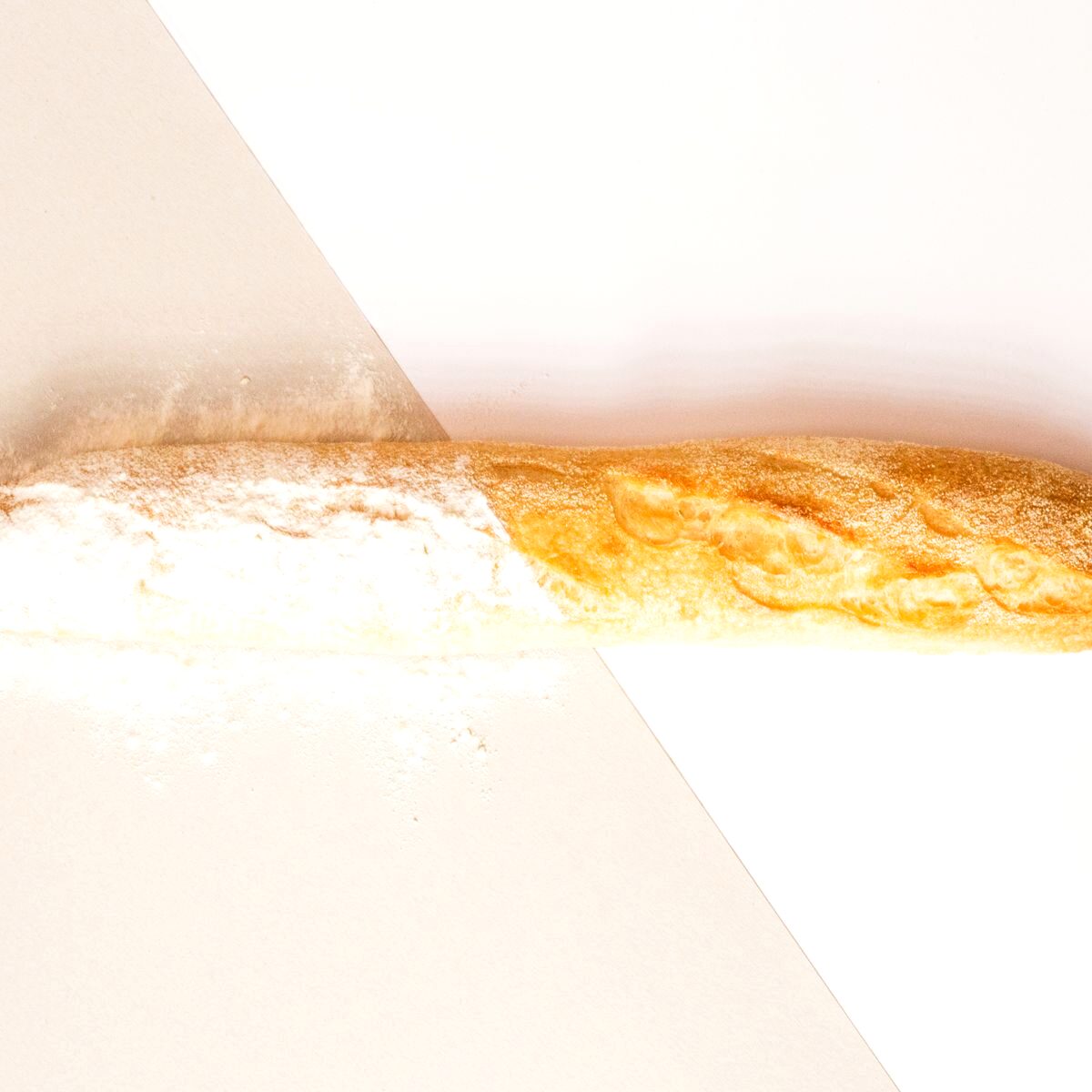 Shaping dough on a floured bench